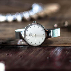 Obaku Sky Steel Quartz 6.4mm Slim Case White MOP Round Dial Women's Watch- V173LXCIMC